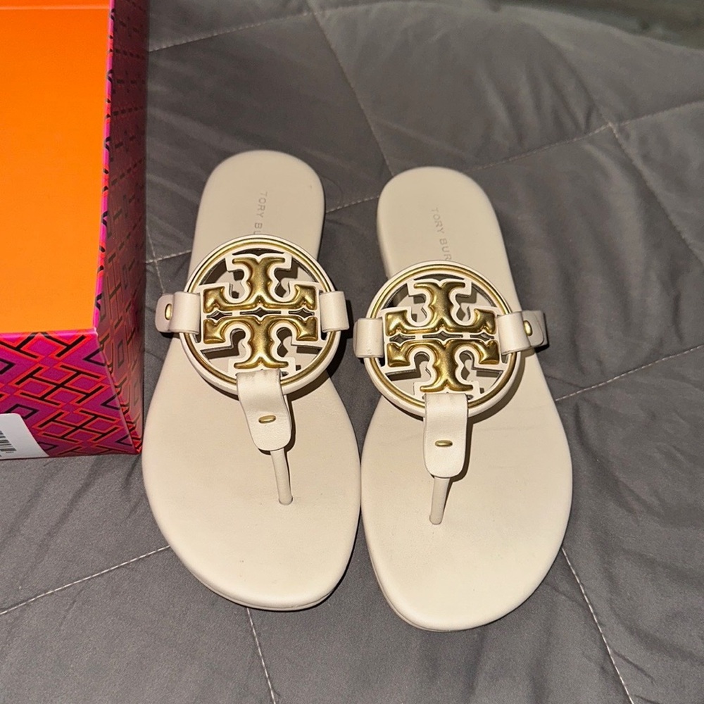 Tory Burch Cream Sandals with Metallic Emblems